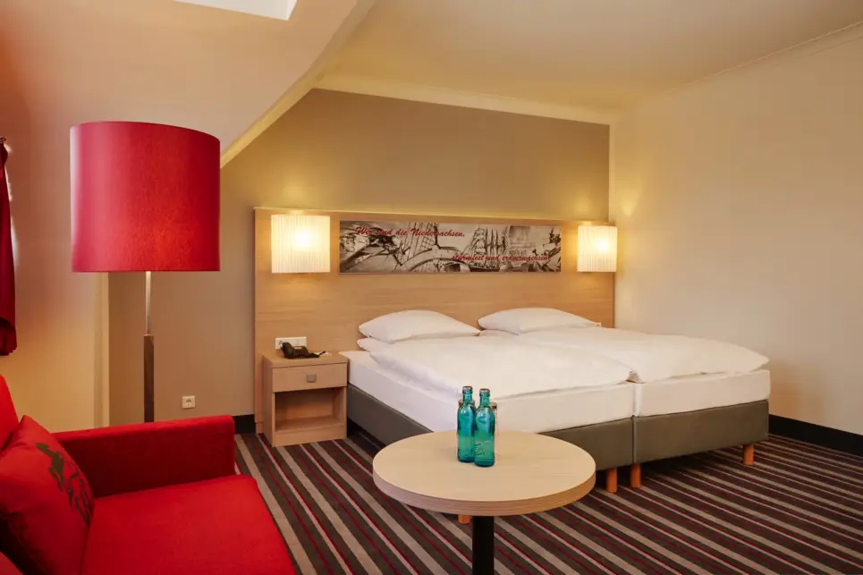 A spacious hotelroom at the H+ Hotel Stade Herzog Widukind - Official website 