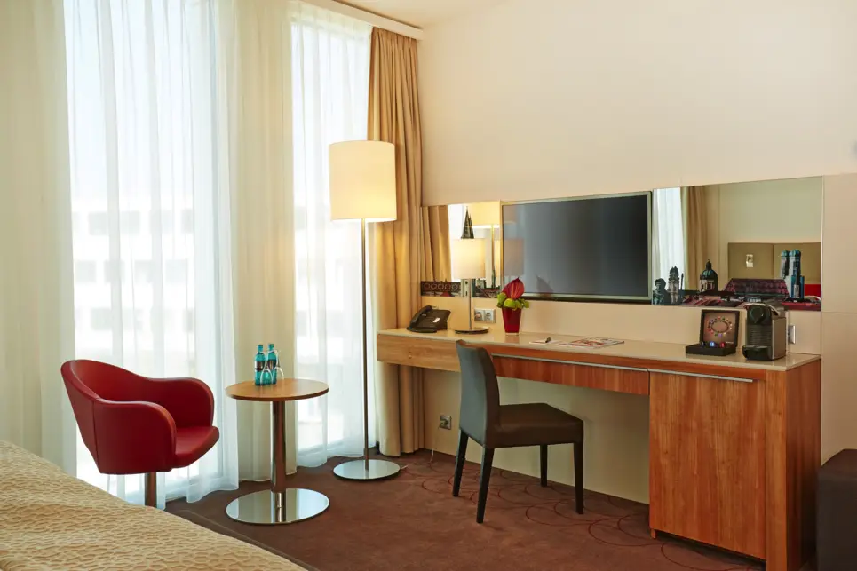 A comfortable hotel room at the H4 Hotel München Messe - Official website