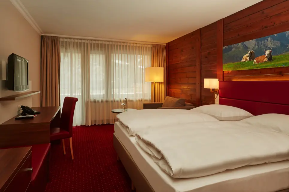 Comfortable superior double room at the H+ Hotel & Spa Engelberg - Official website