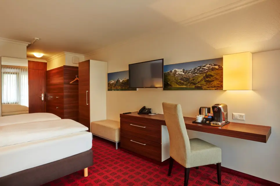 Deluxe double room at the H+ Hotel & Spa Engelberg - Official website