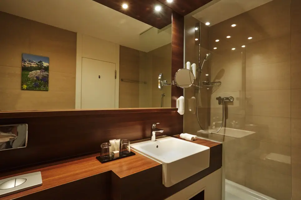 Bathroom - Superior apartment at the H+ Hotel & Spa Engelberg - Official website